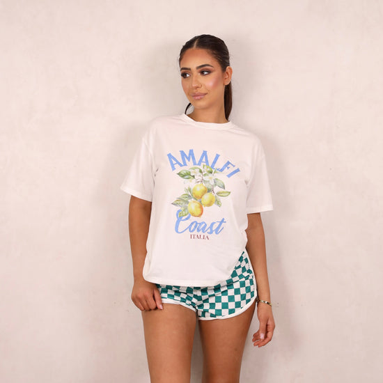Model wearing a graphic tee and shorts set.