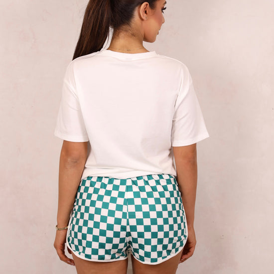 Model wearing a graphic tee and shorts set.