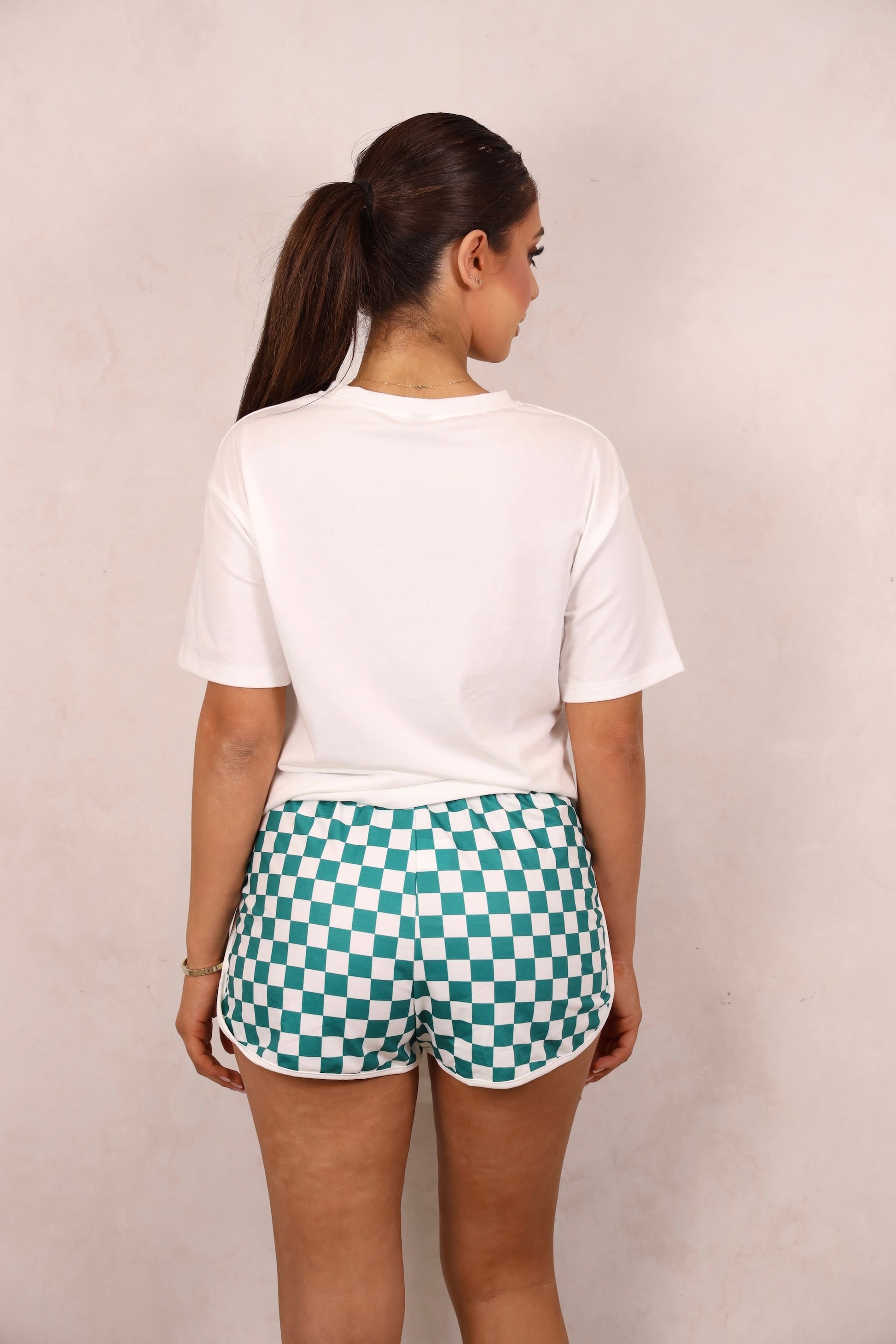 Model wearing a graphic tee and shorts set.